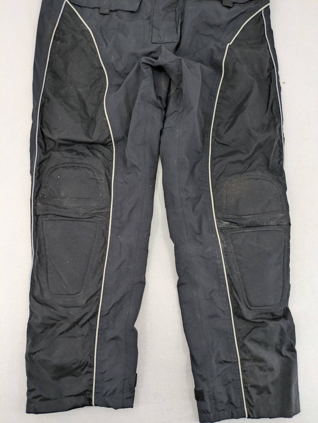 Polo black chaps with grey and white accents, featuring protective knee pads and adjustable belt.