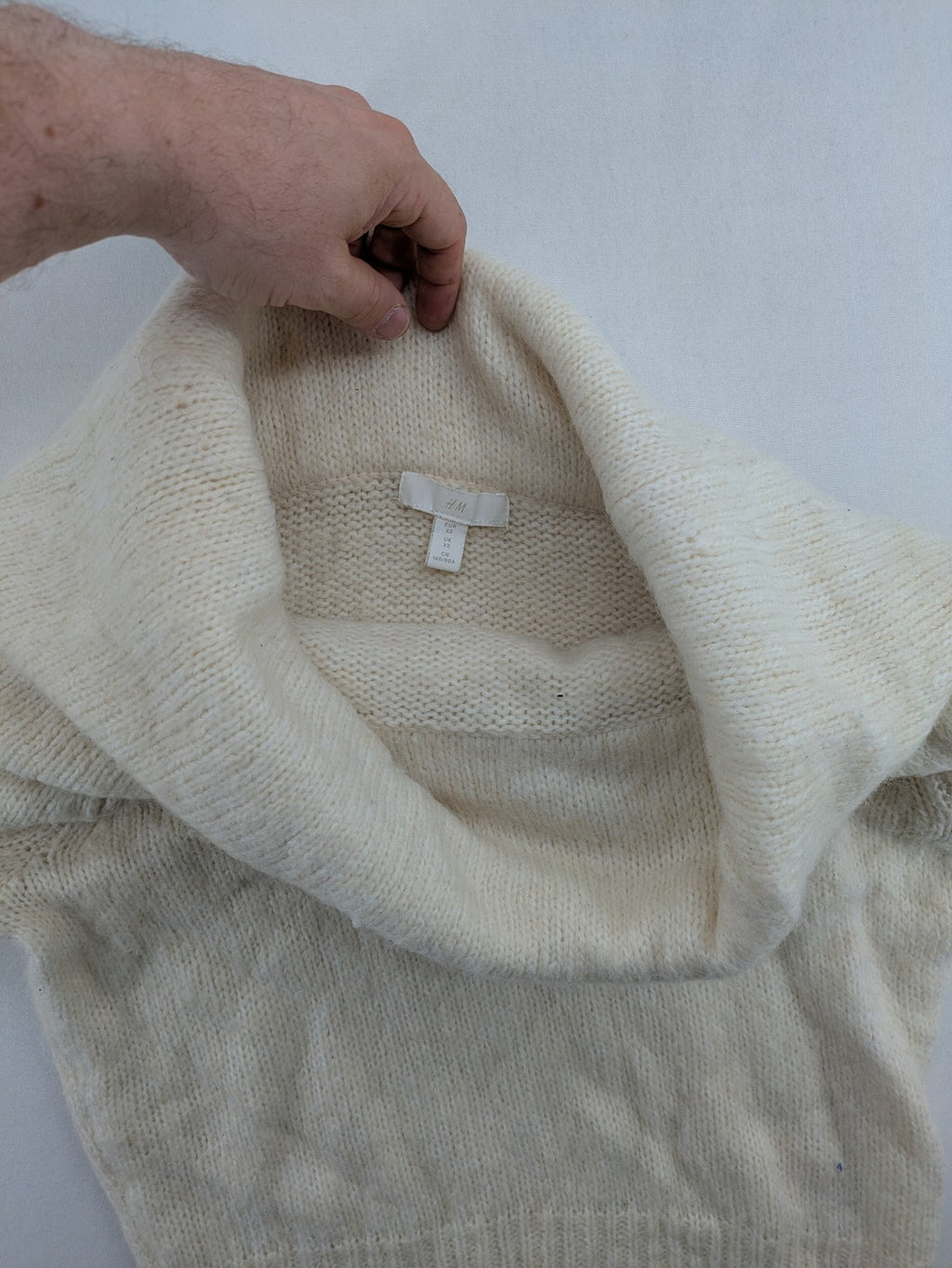 H&M beige turtle neck jumper soft alpaca blend off-shoulder design with wide collar.