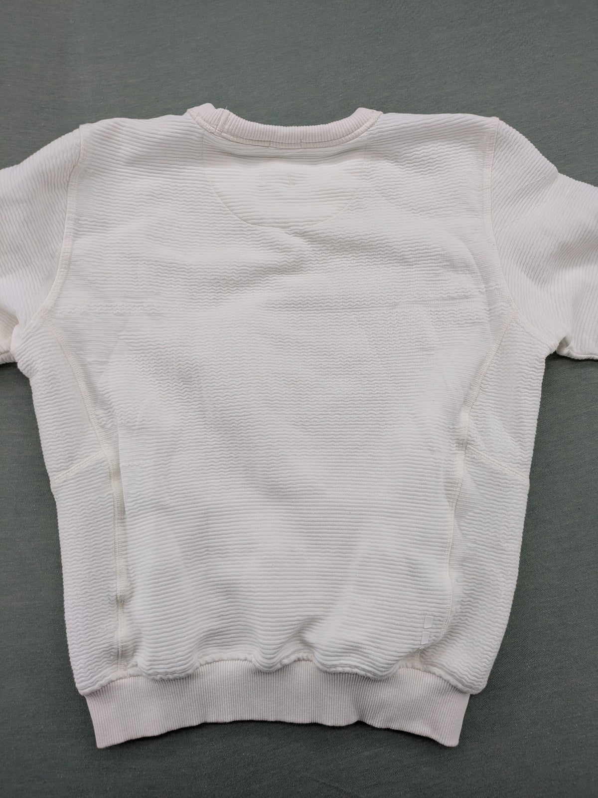CHASIN' grey and white turtle neck jumper with horizontal ribbed texture and logo patch.