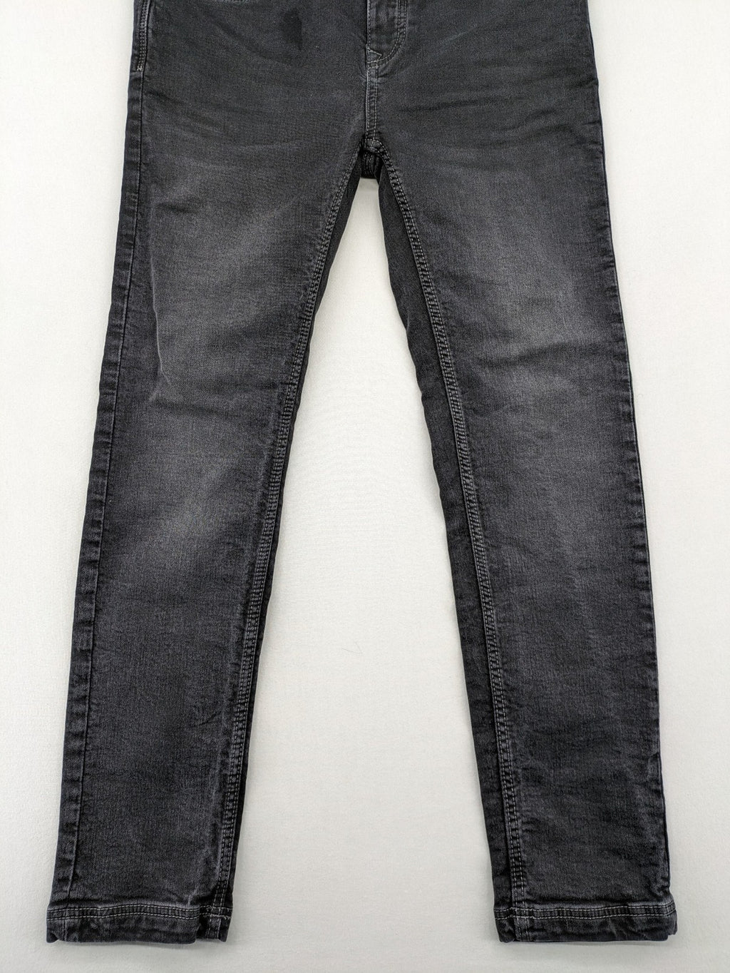 Tom Tompson grey slim tapered jeans with washed denim finish and subtle branding.