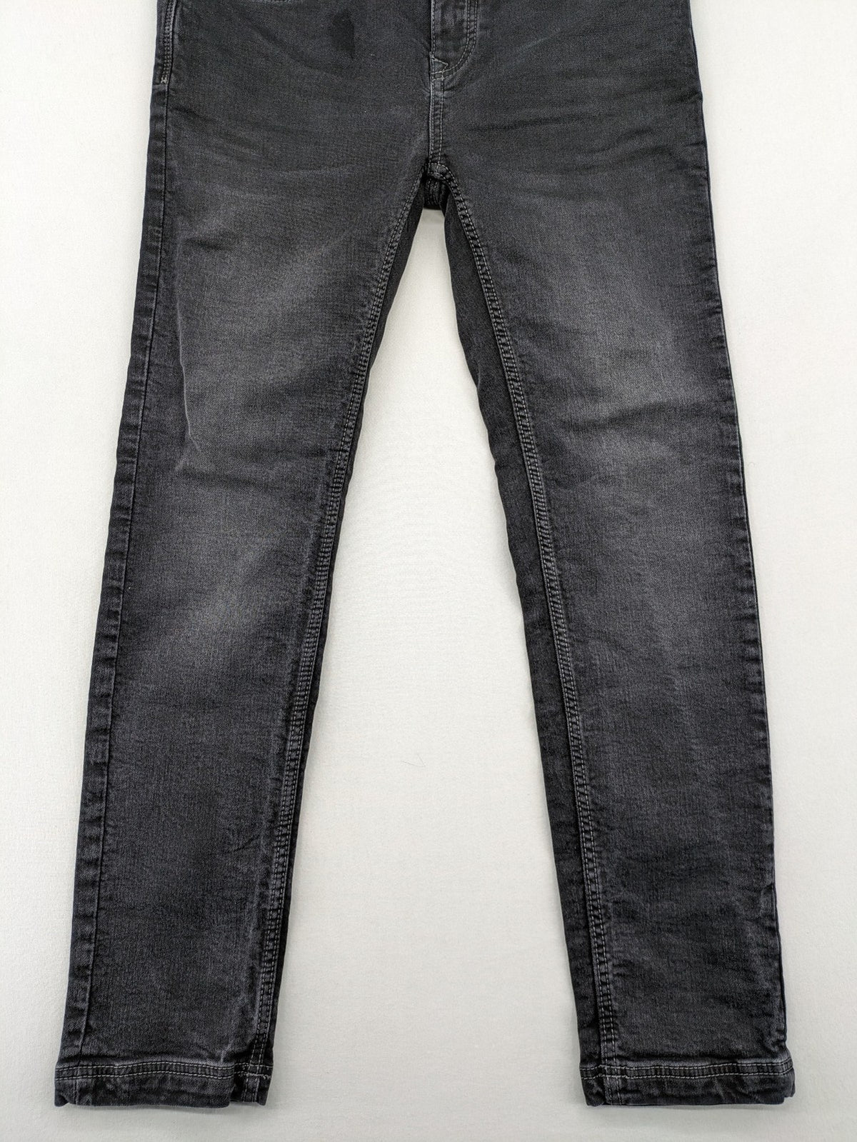 Tom Tompson grey slim tapered jeans with washed denim finish and subtle branding.