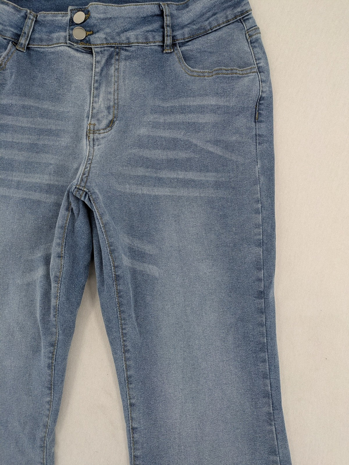 C&A blue bootcut jeans high waist stretch denim with double button closure.