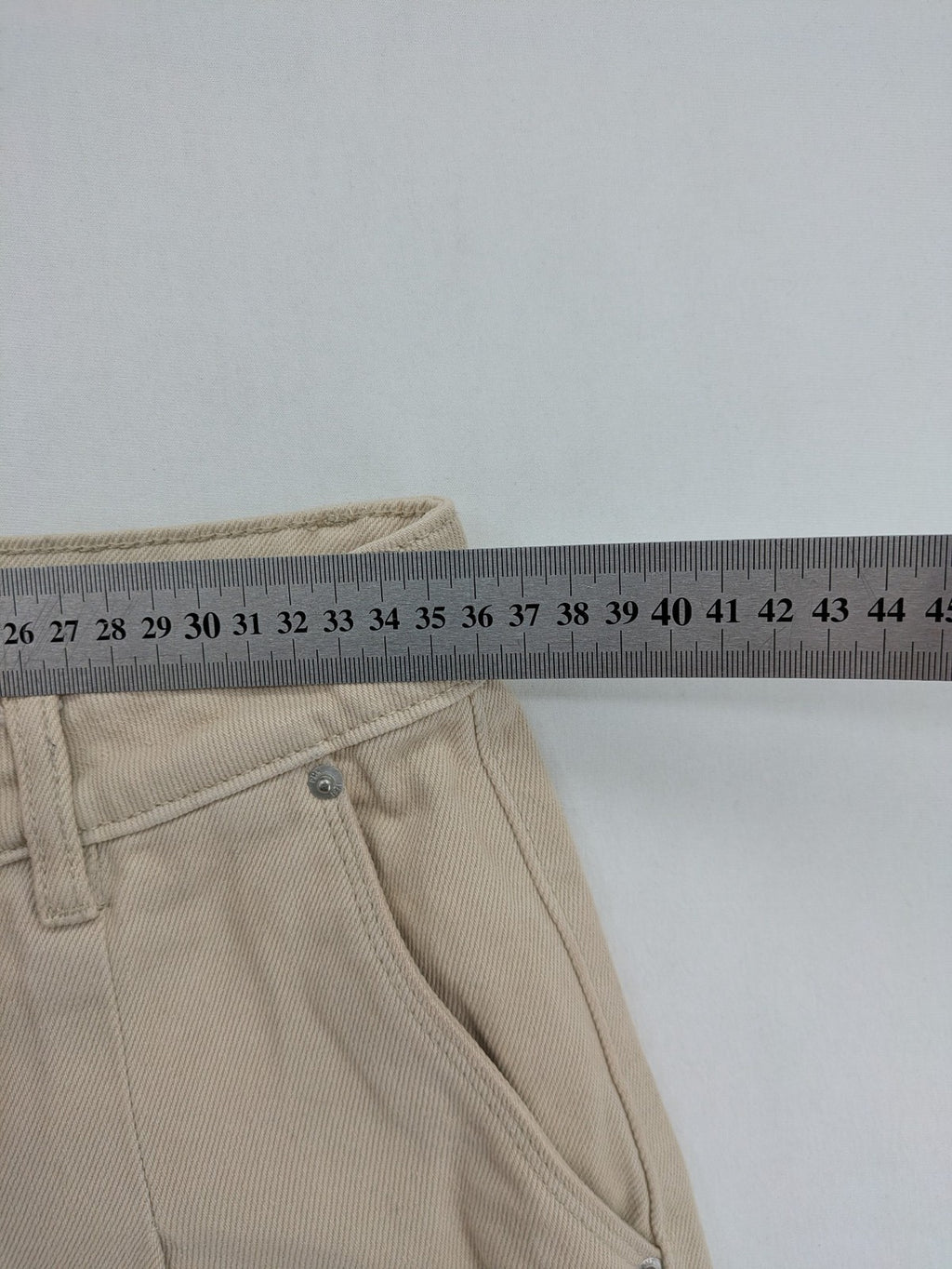 Pimkie beige mom jeans high waist tapered fit with front button placket and cotton material.