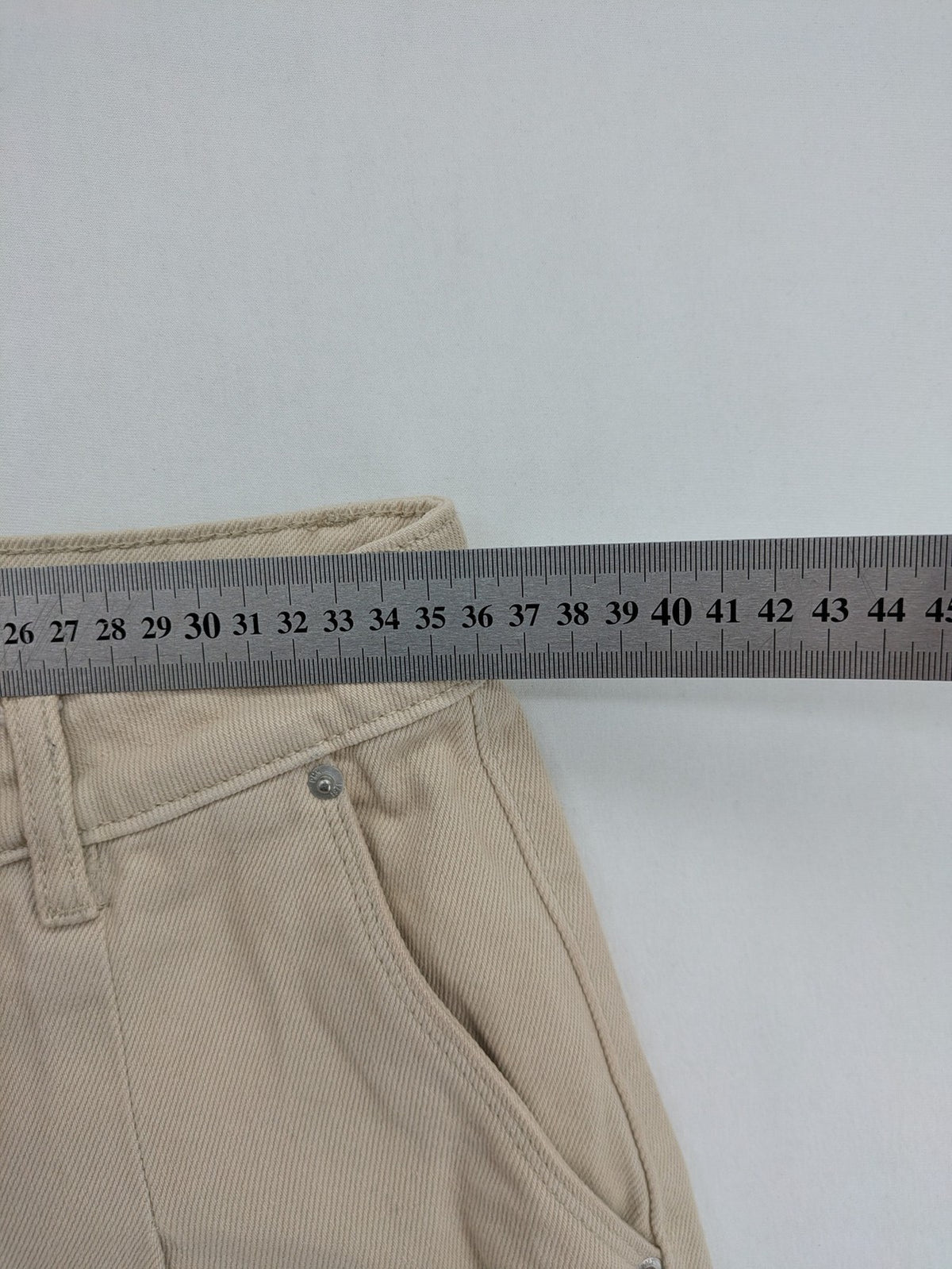 Pimkie beige mom jeans high waist tapered fit with front button placket and cotton material.