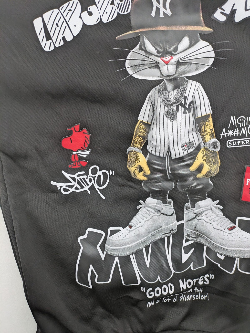 Kuima multi graphic hoodie black featuring large Bugs Bunny print and kangaroo pocket.