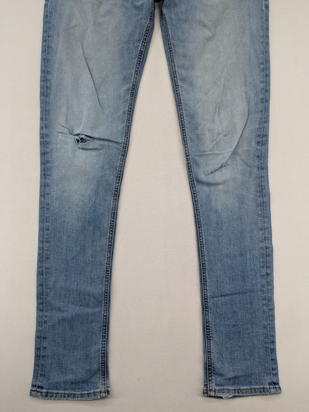 Jack & Jones blue slim jeans with button fly and subtle used look.