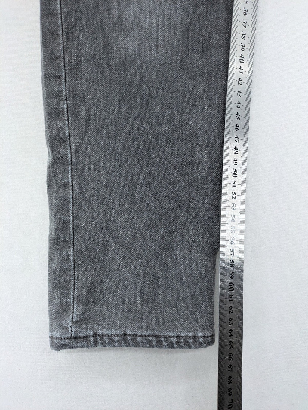 H&M grey jogger jeans with elastic waistband and drawstring, stylish washed look.