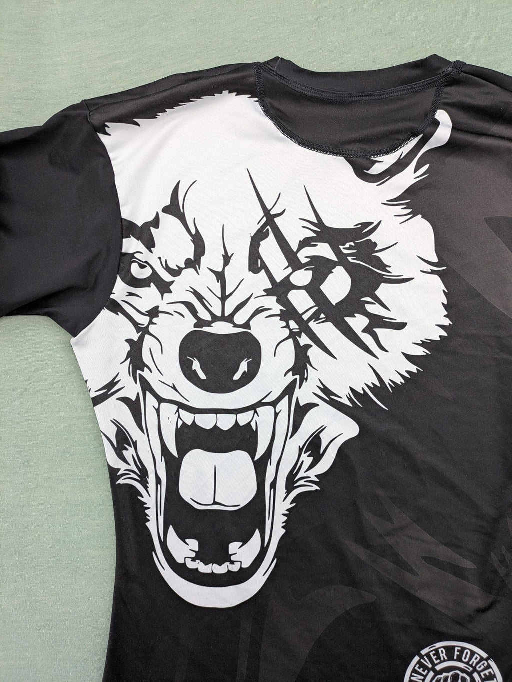 FORMMMA black rashguard featuring striking white wolf graphic and "Chechen Warrior" text.