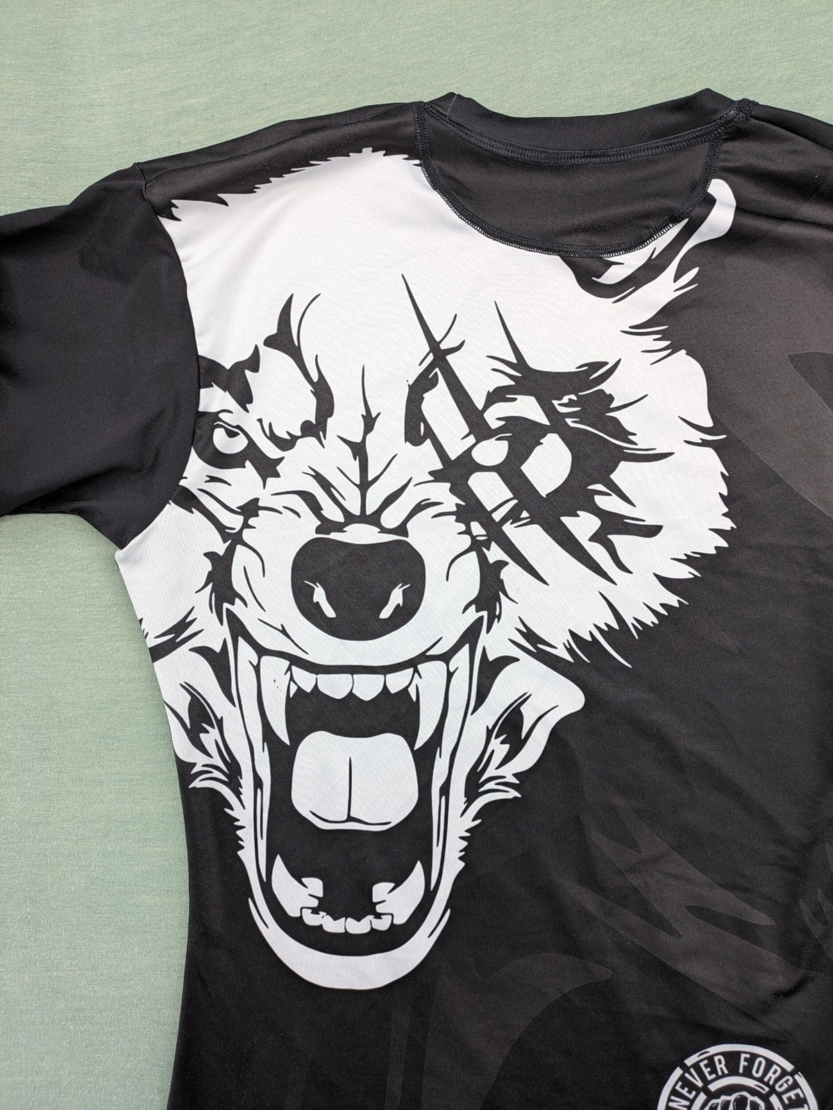 FORMMMA black rashguard featuring striking white wolf graphic and "Chechen Warrior" text.