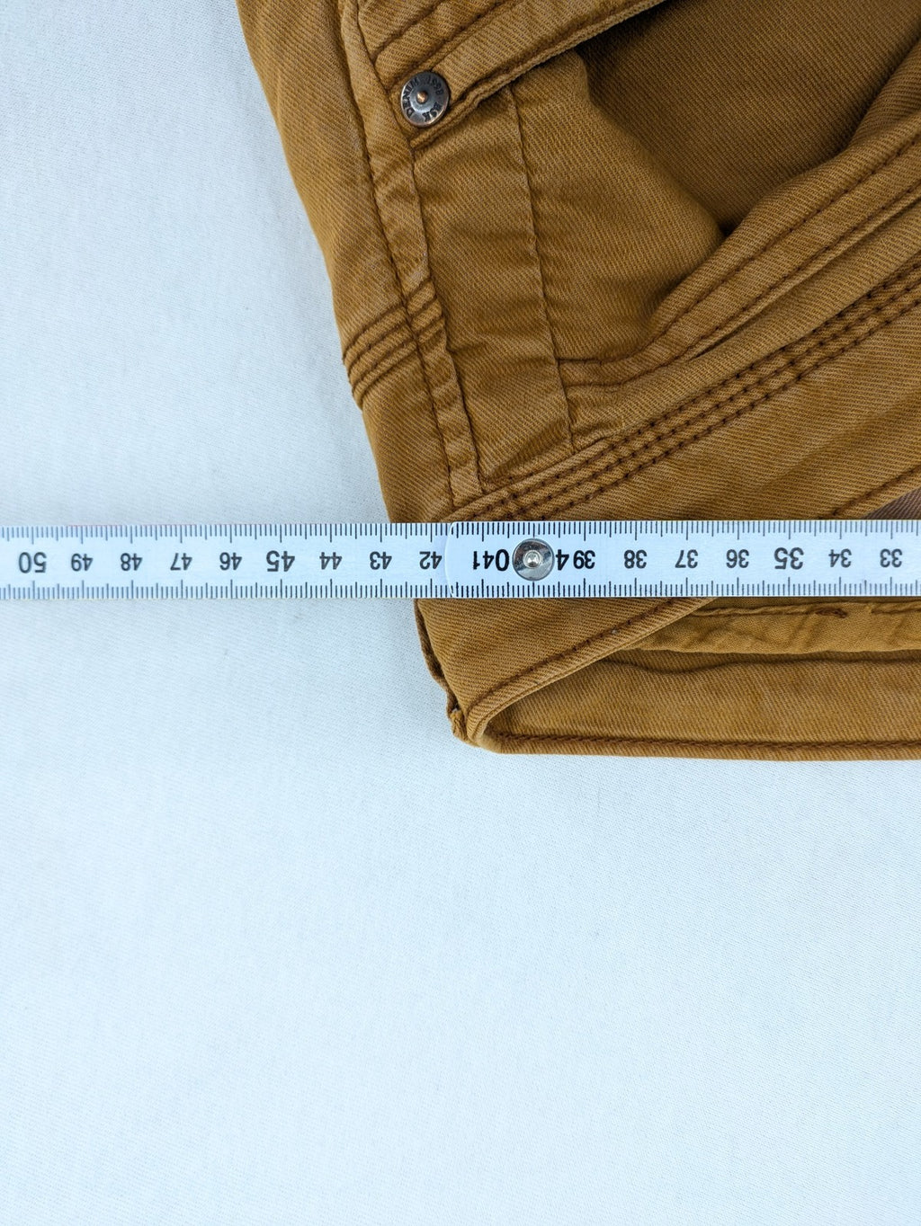 Bershka brown straight jeans slim fit classic 5-pocket design with prominent stitching.