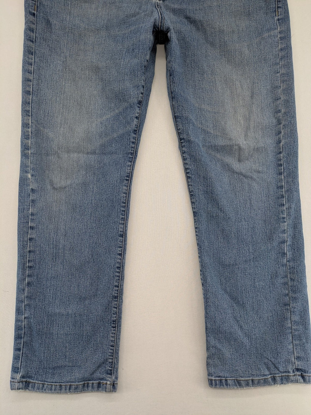 Digel blue straight jeans with classic medium wash and durable cotton denim material.