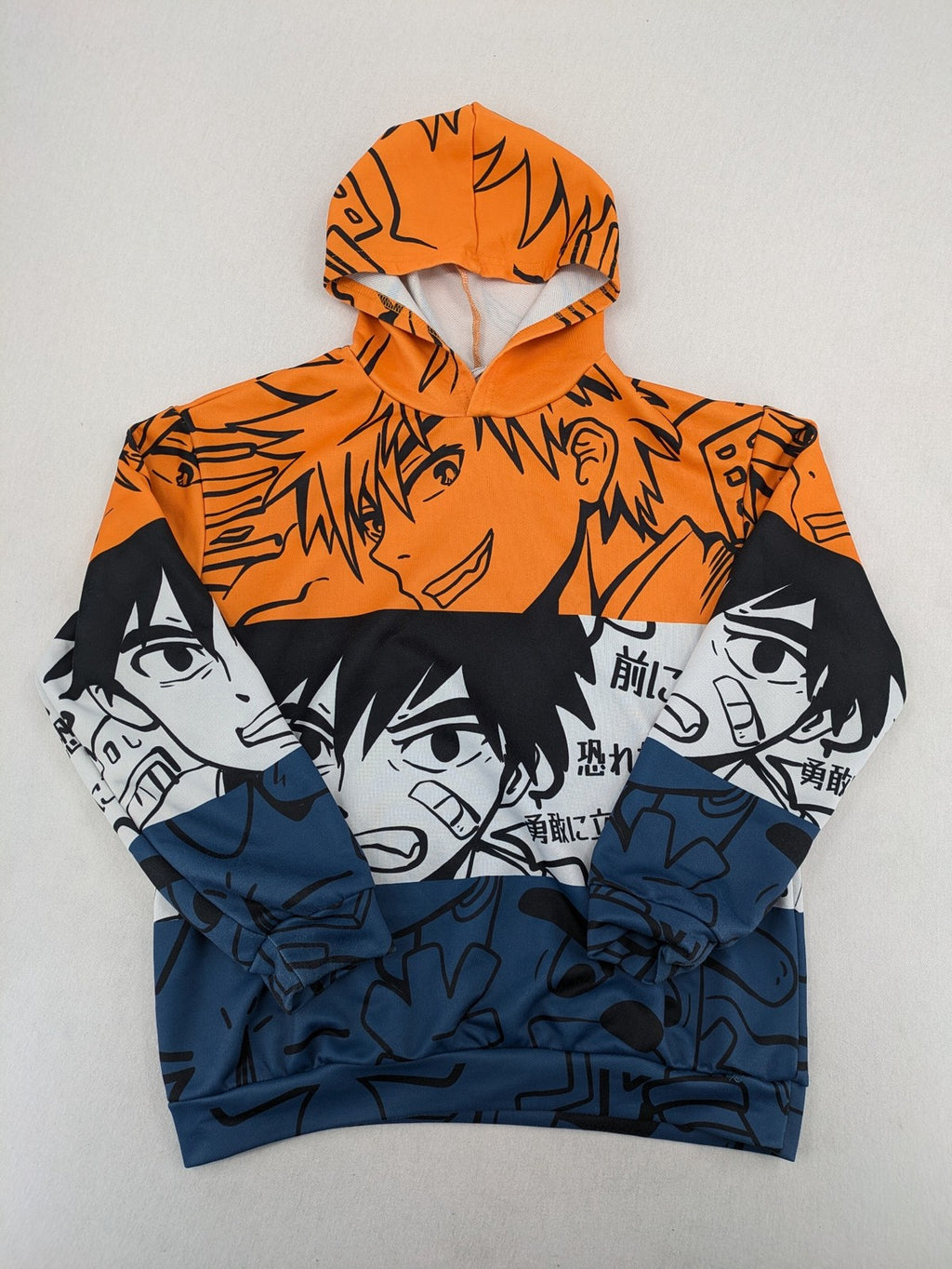 SHEIN orange zip-through hoodie with vibrant anime graphic print and colorblock design.