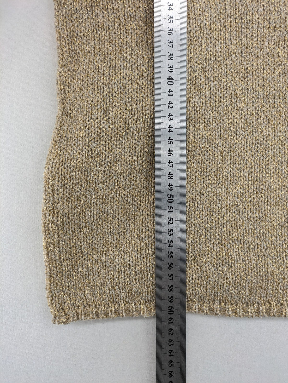 Rick Cardona beige turtle neck jumper with gold metallic thread and balloon sleeves.