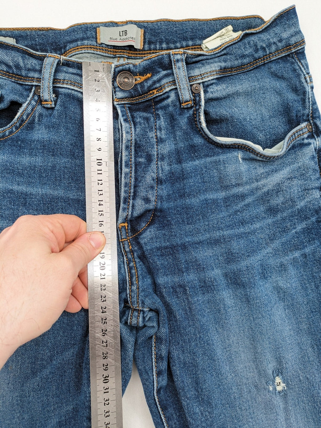 LTB blue straight jeans with low rise, button fly, and classic denim wash.