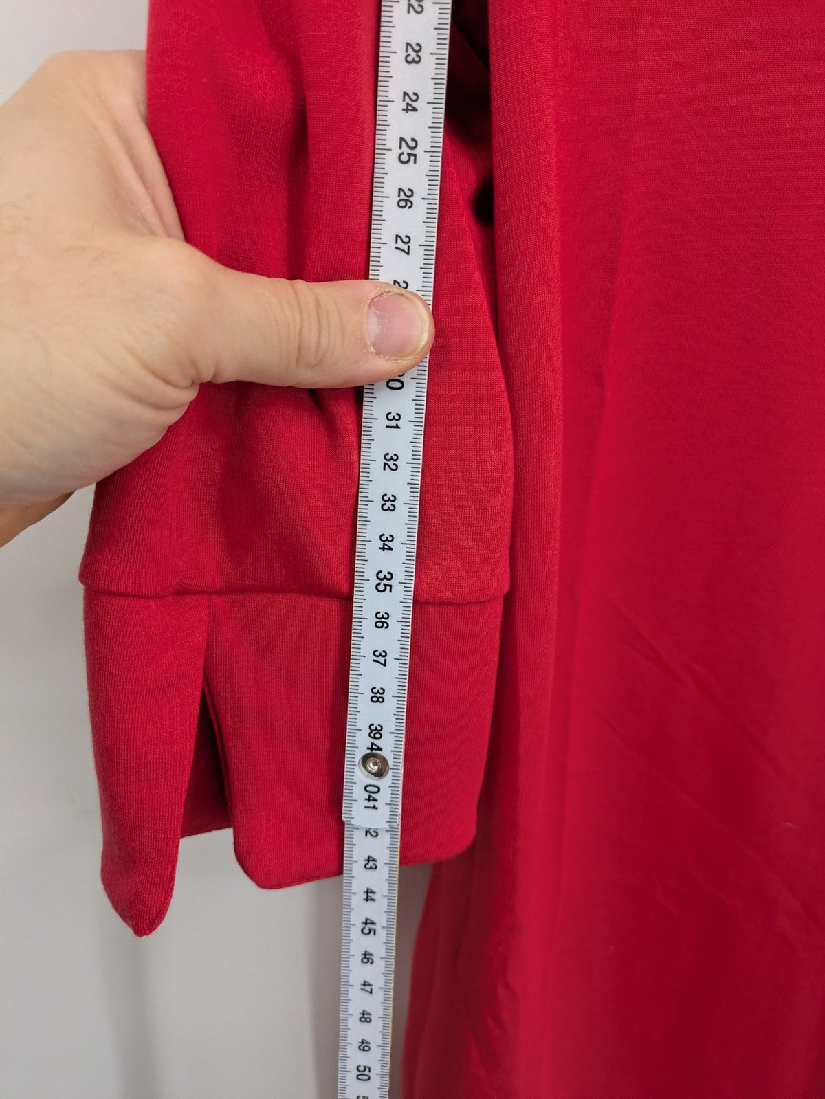 H&M red A-line dress with stand collar, 3/4 sleeves, and side pockets in stretchy jersey.