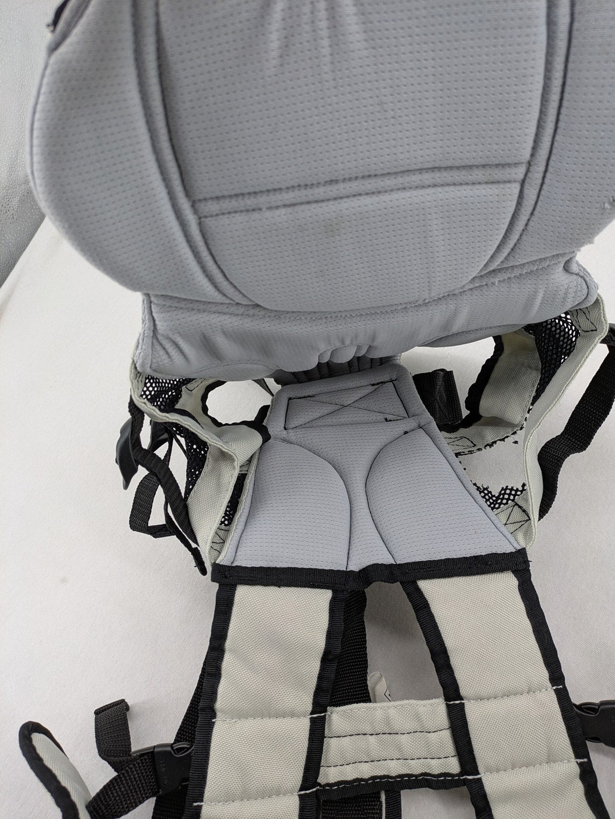 Chicco beige and black baby carrier adjustable straps with padded support for comfort.