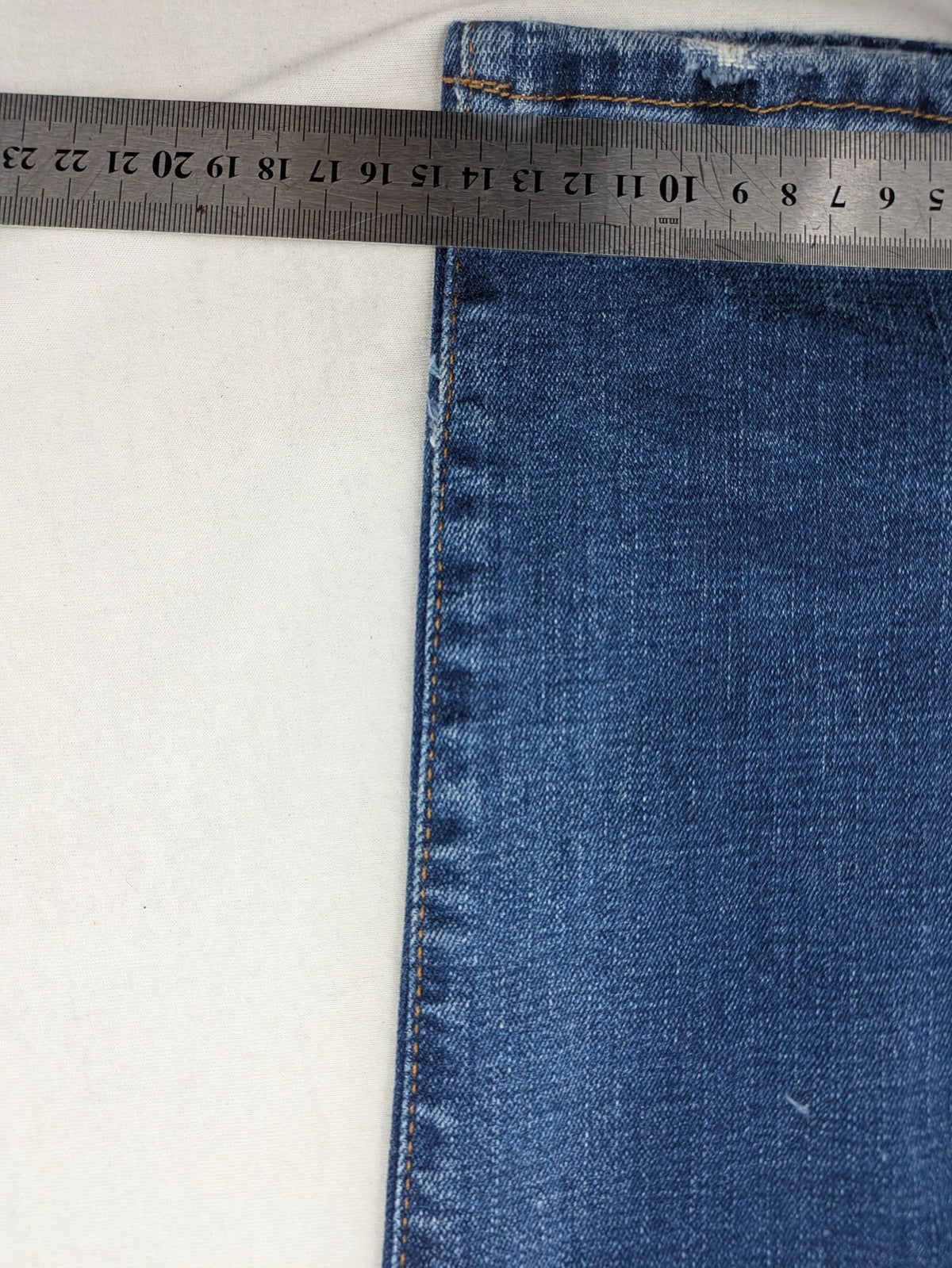 ICON 2 blue slim fit jeans distressed stretch denim with button fly and faded details.