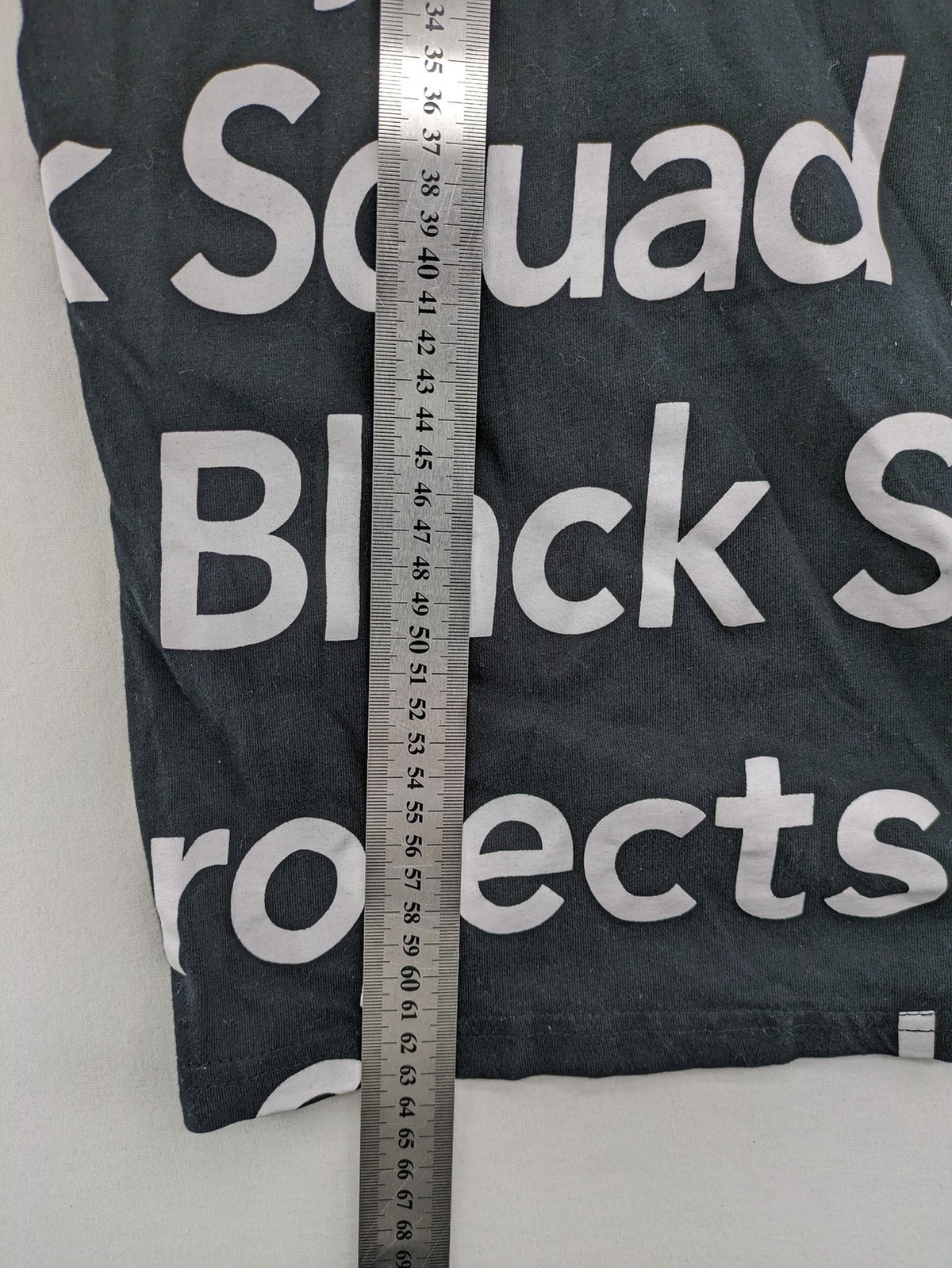 Black Squad black t-shirt all-over graphic print with logo patch on sleeve.
