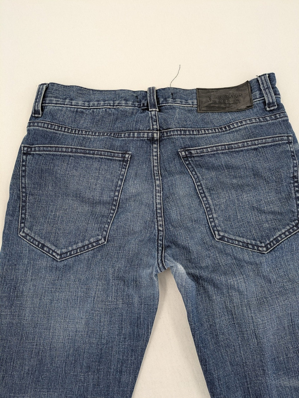Trussardi blue straight jeans with classic 5-pocket design and durable denim material.