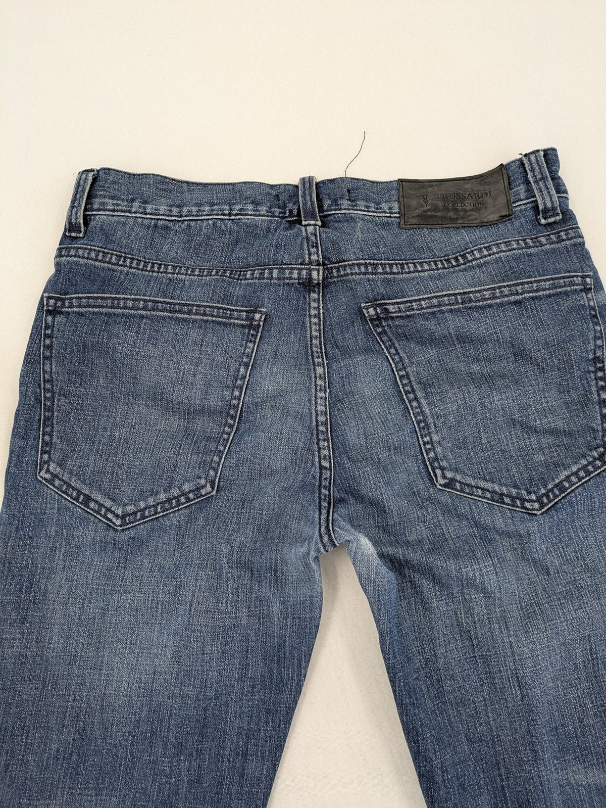Trussardi blue straight jeans with classic 5-pocket design and durable denim material.
