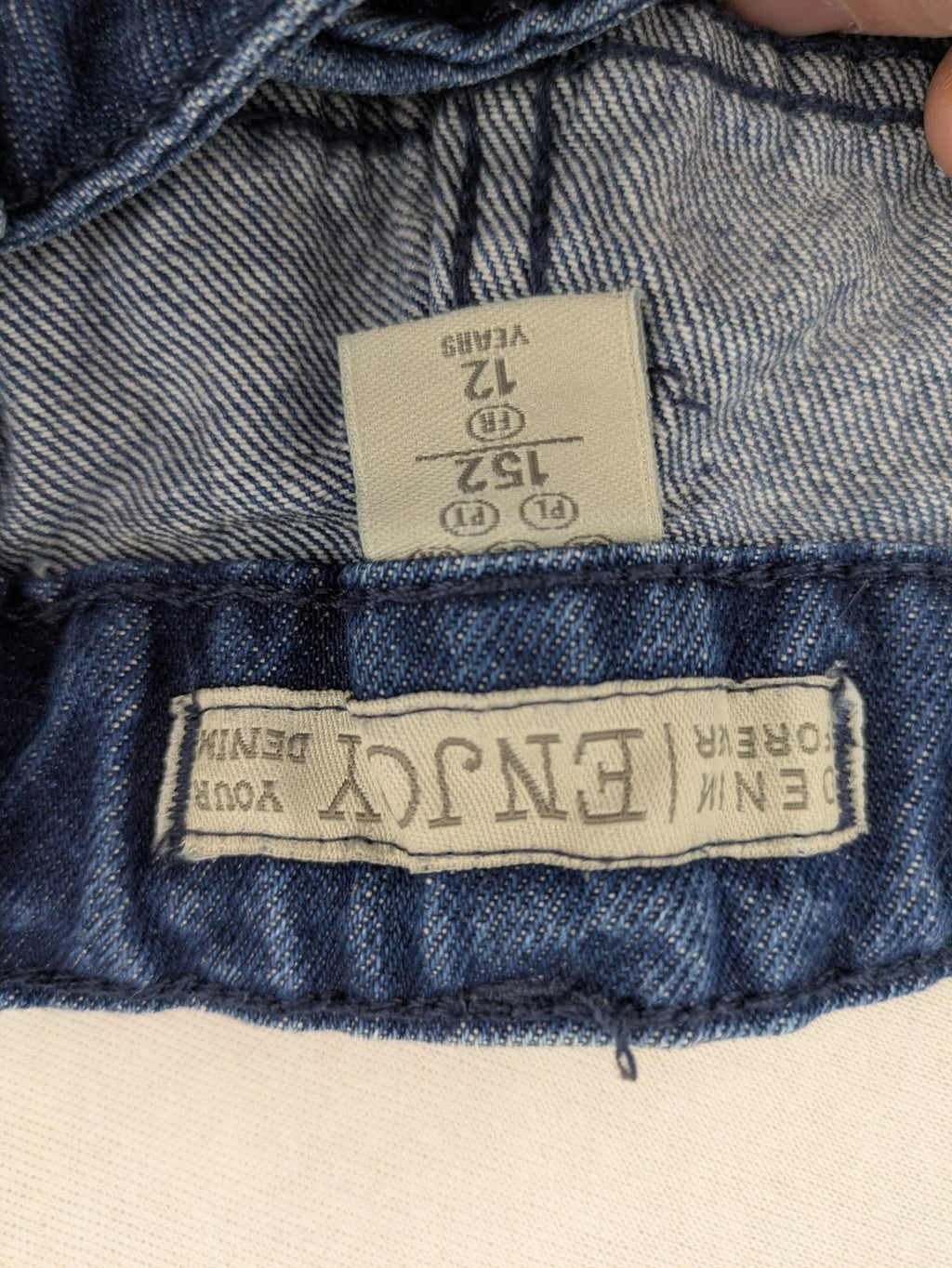 Pocopiano blue denim shorts with rolled cuffs and elastic waistband for comfort.