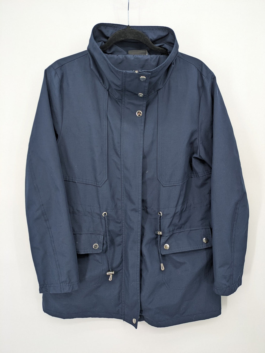 Janina navy anorak jacket with high collar and adjustable drawstring waist.