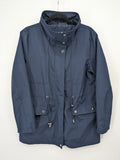 Janina navy anorak jacket with high collar and adjustable drawstring waist.