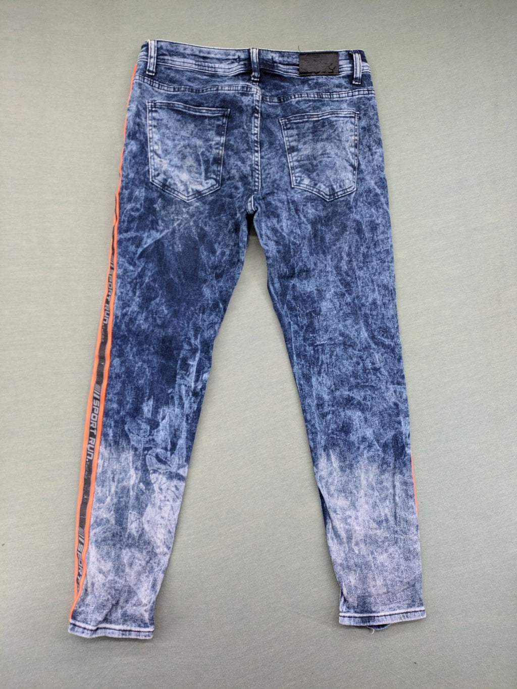 Stark straight jeans multi distressed acid wash with orange patches and side stripes.