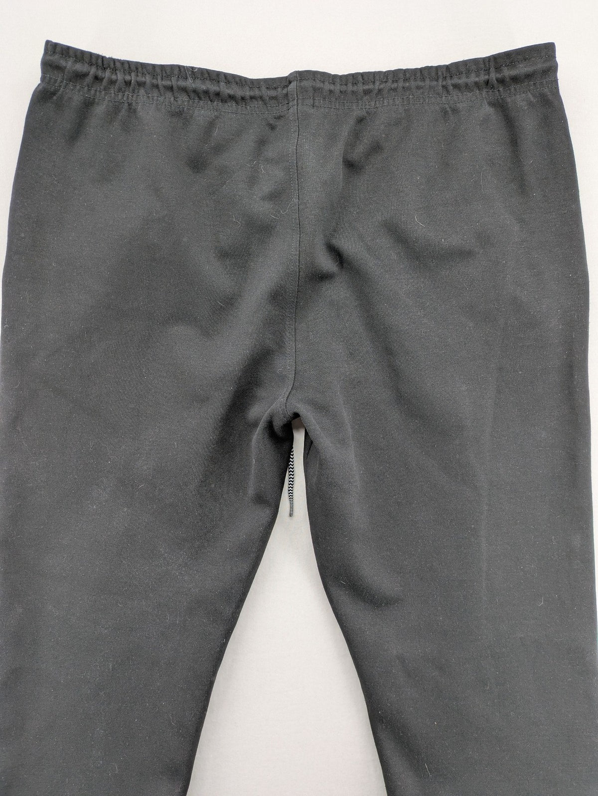 K1X grey joggers with white basketball logo, elastic waistband, and cuffed ankles.