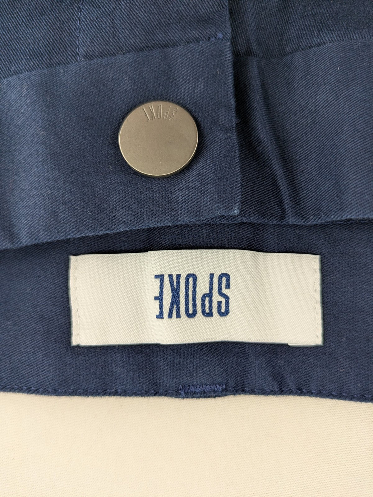 Spoke navy chino shorts flat front with unique printed pocket lining.