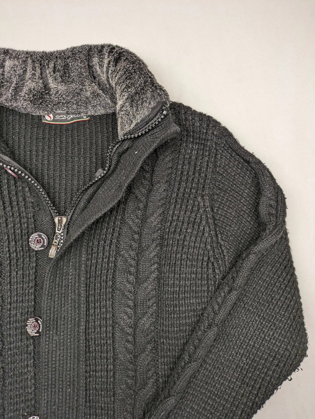 SCD Green grey turtle neck jumper with cable knit pattern and dual closure.