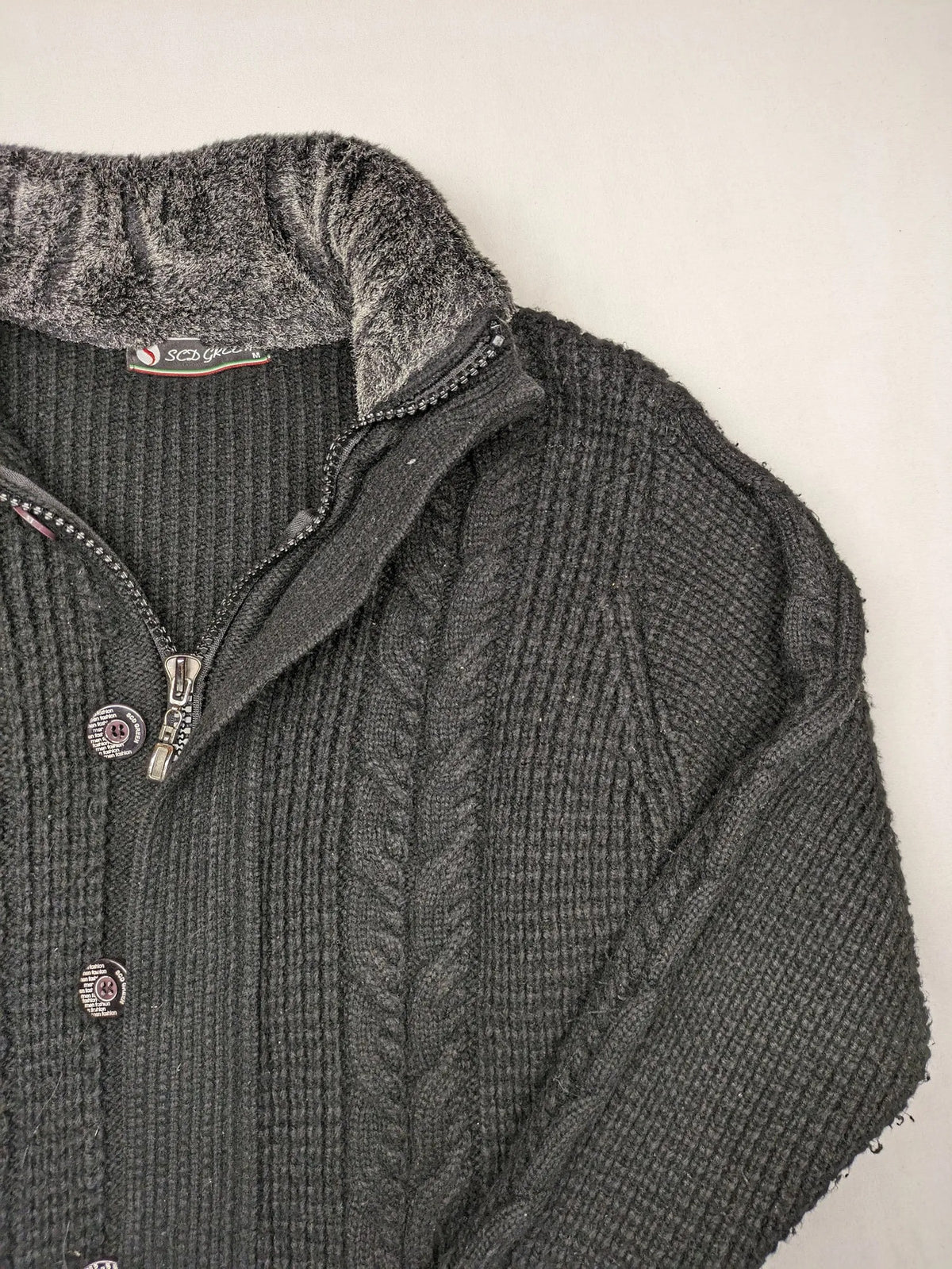 SCD Green grey turtle neck jumper with cable knit pattern and dual closure.