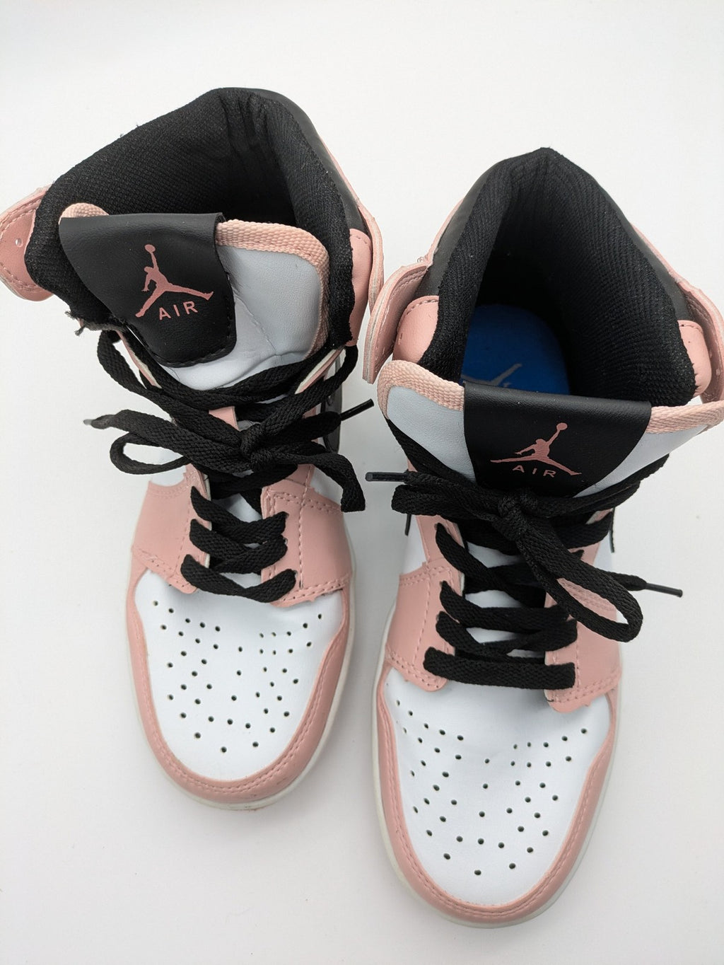 Nike Air Jordan high-top sneakers multi with Wings logo, Jumpman detail, and perforated toe.