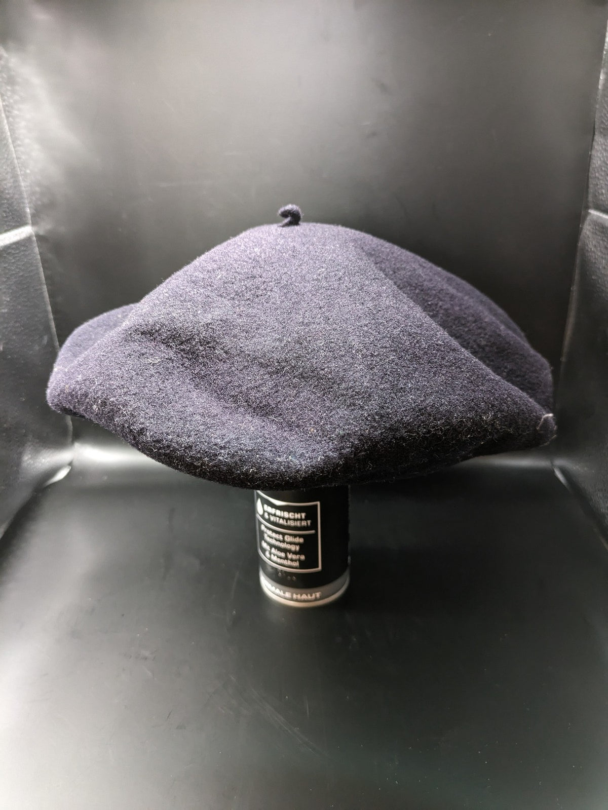 Luxe navy beret pure wool waterproof with emblem lining and leather band.