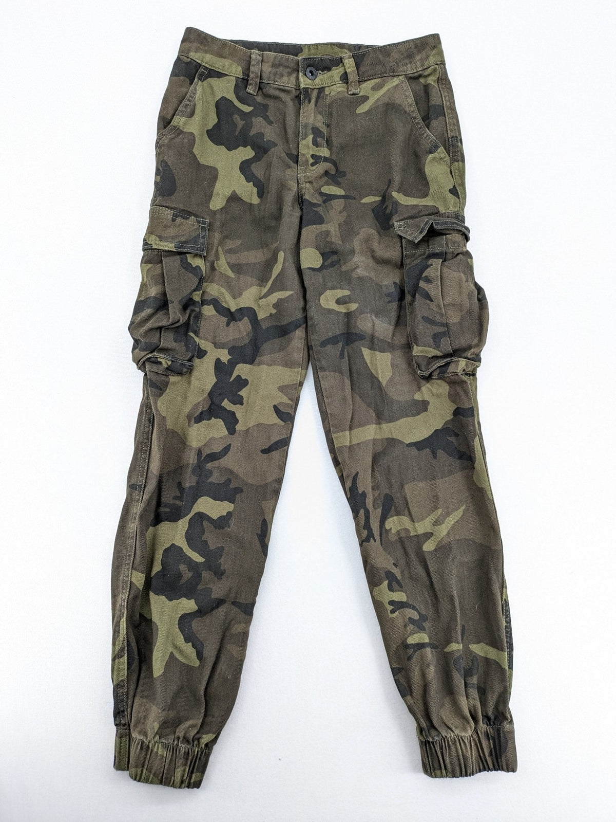 Rainbow camouflage cargo pants in green-brown with jogger silhouette and multiple pockets.