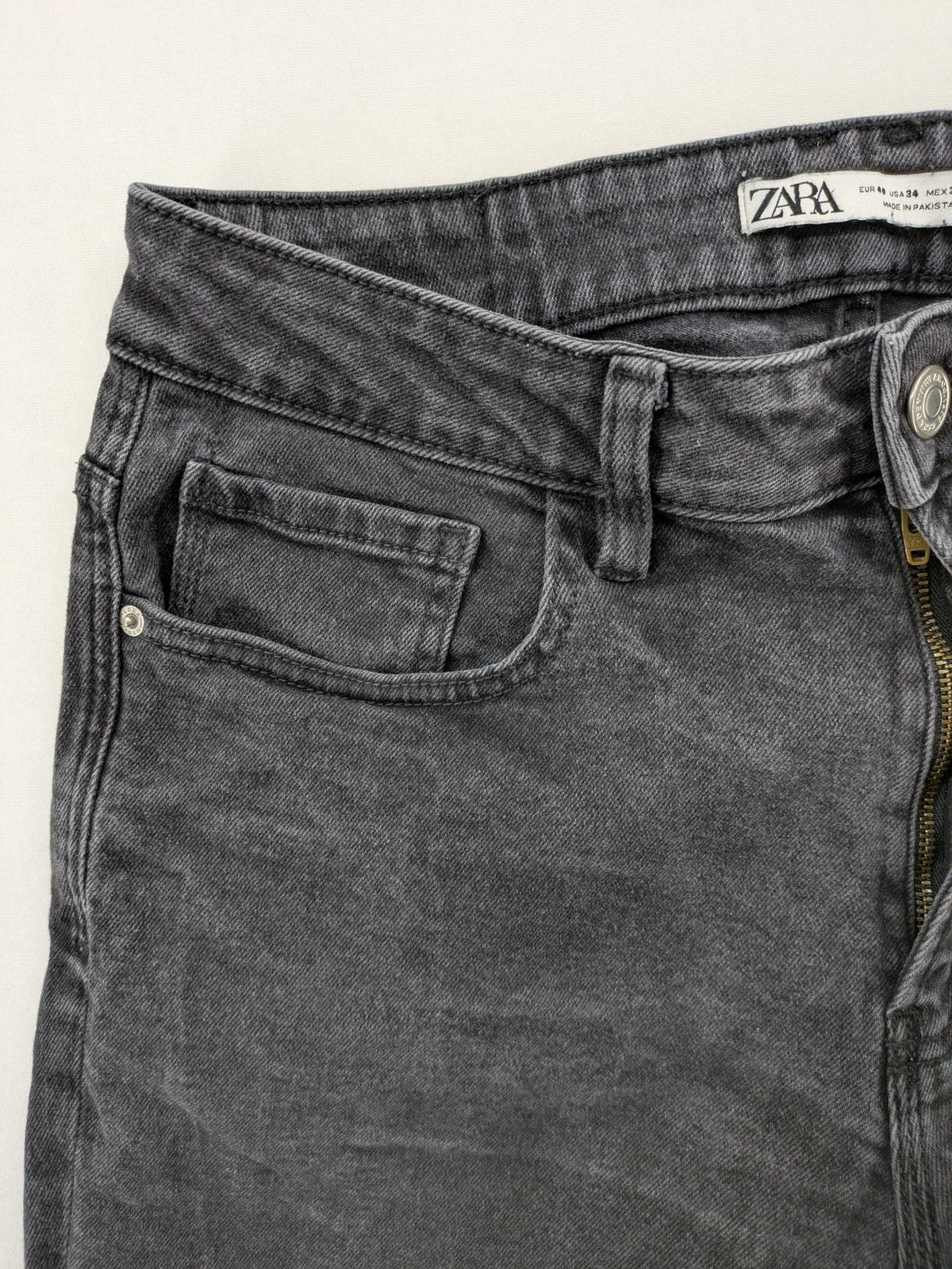 Zara black straight jeans faded wash five-pocket design with zipper closure.