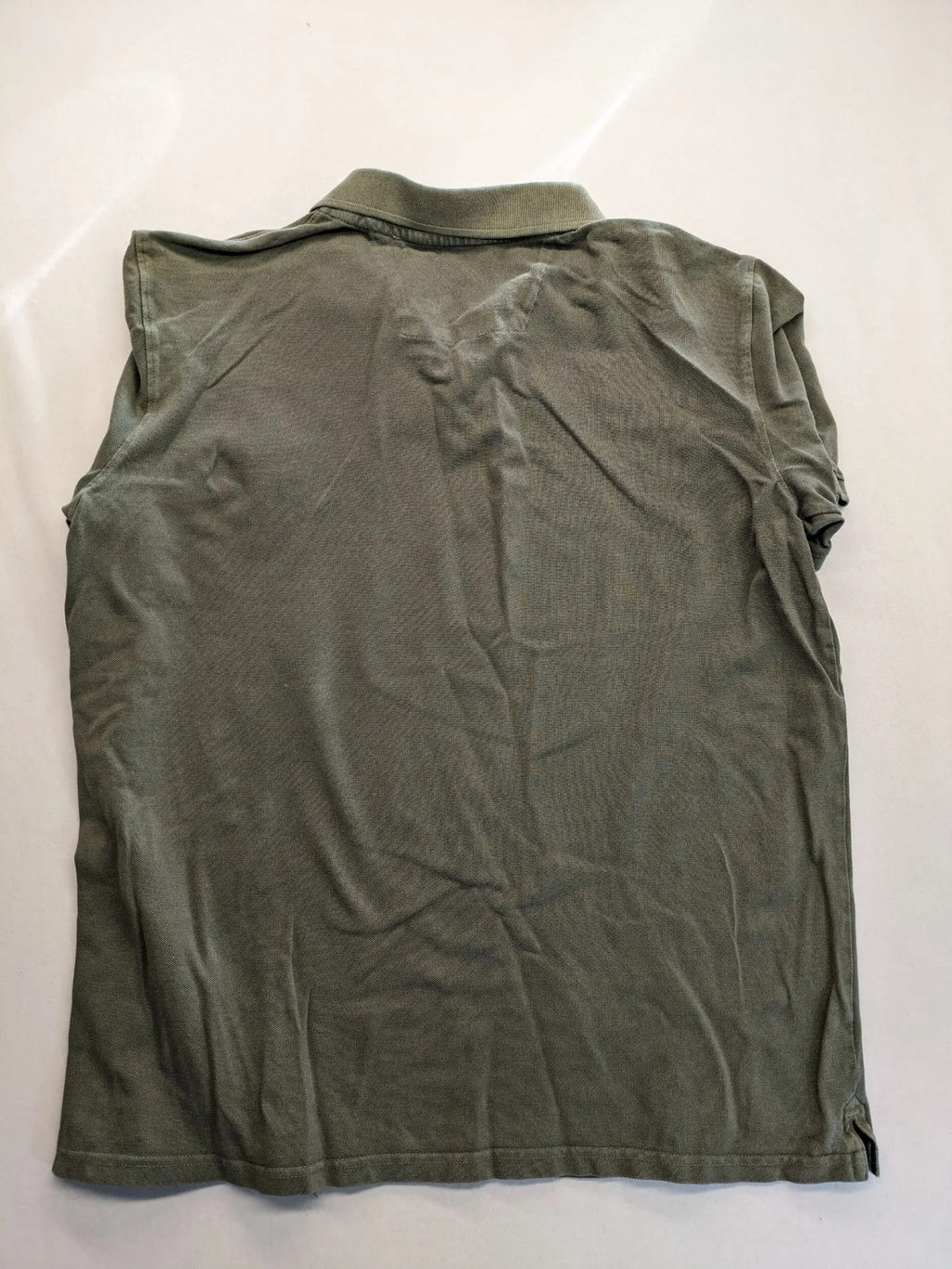 Globe-Trotter beige khaki polo shirt with classic collar and small chest logo.
