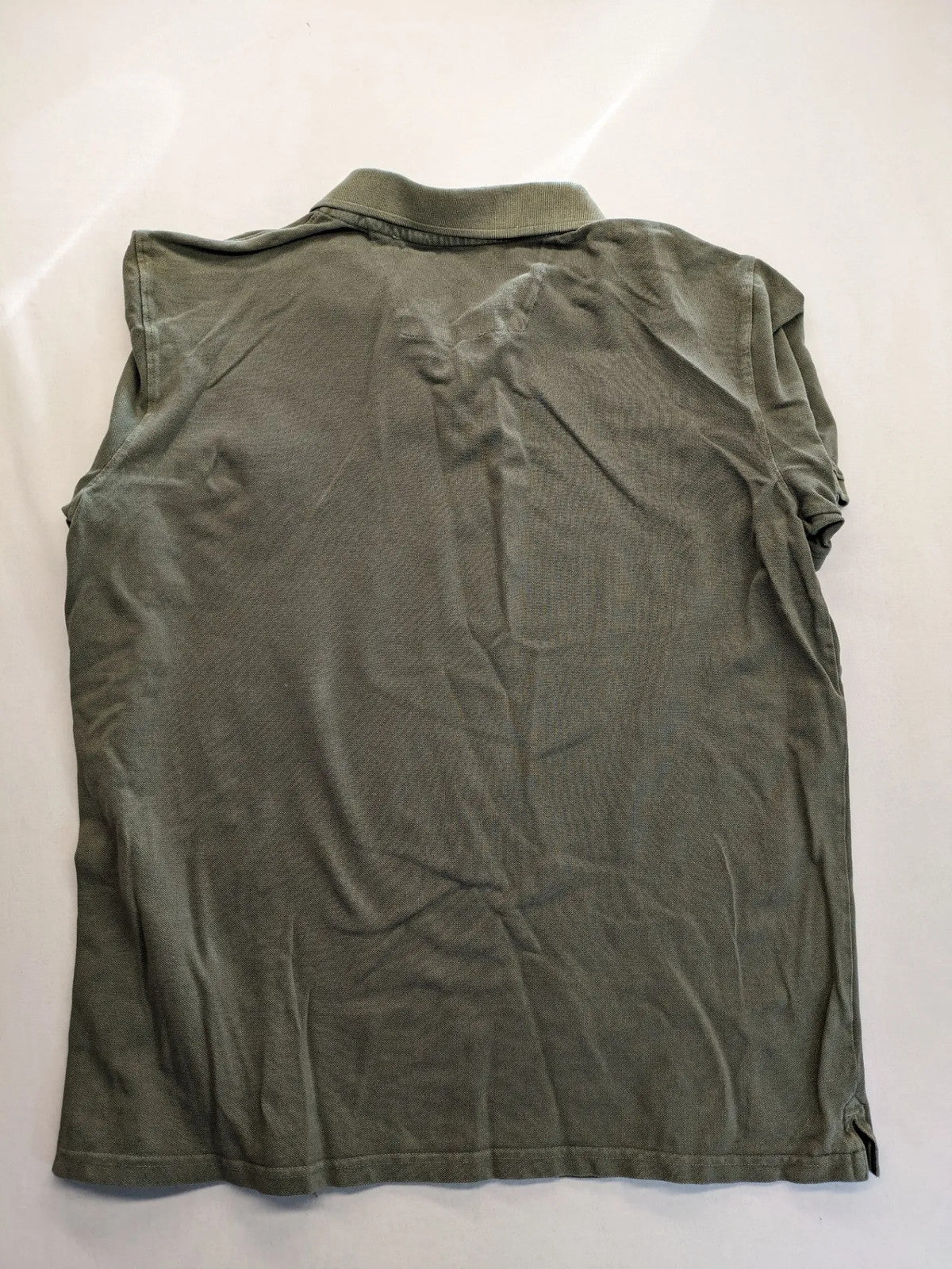 Globe-Trotter beige khaki polo shirt with classic collar and small chest logo.