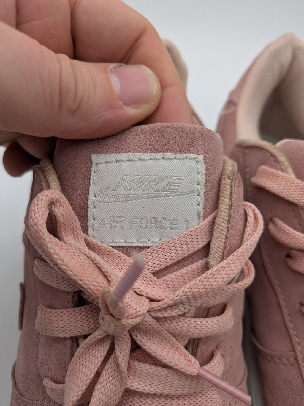 Nike Air Force 1 Low Top pink suede with perforated toe box and white sole