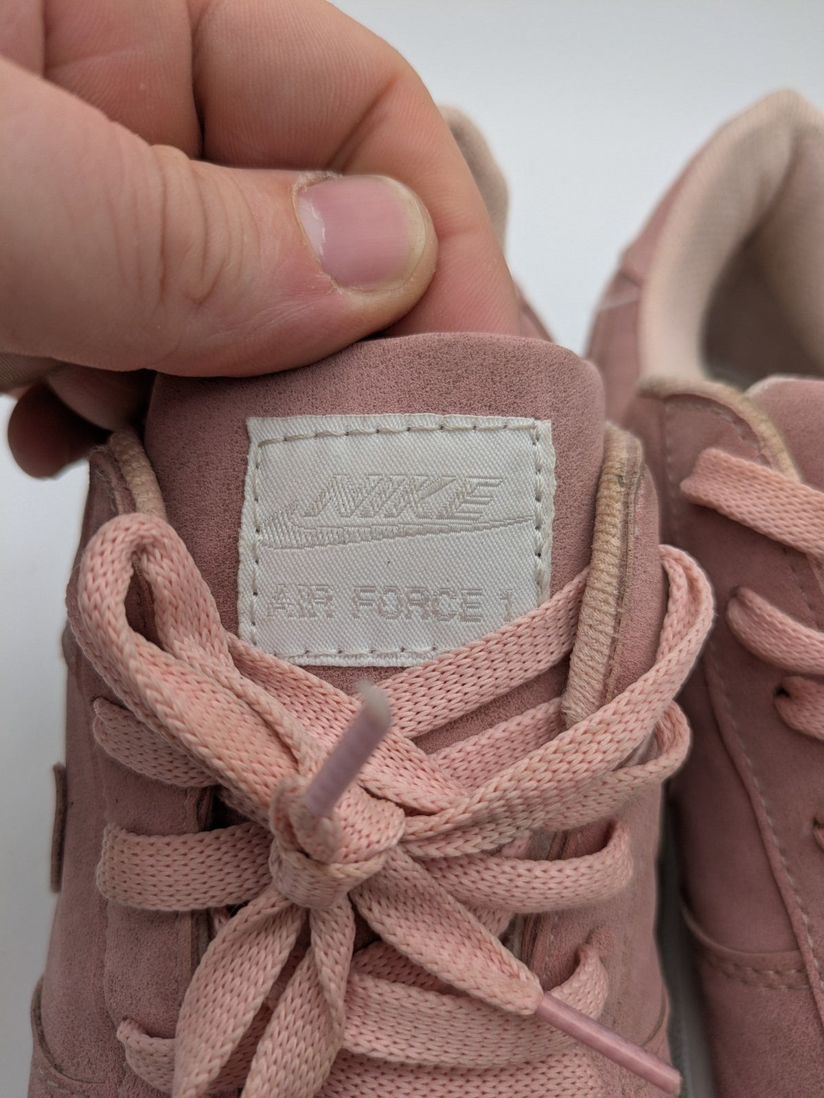 Nike Air Force 1 Low Top pink suede with perforated toe box and white sole