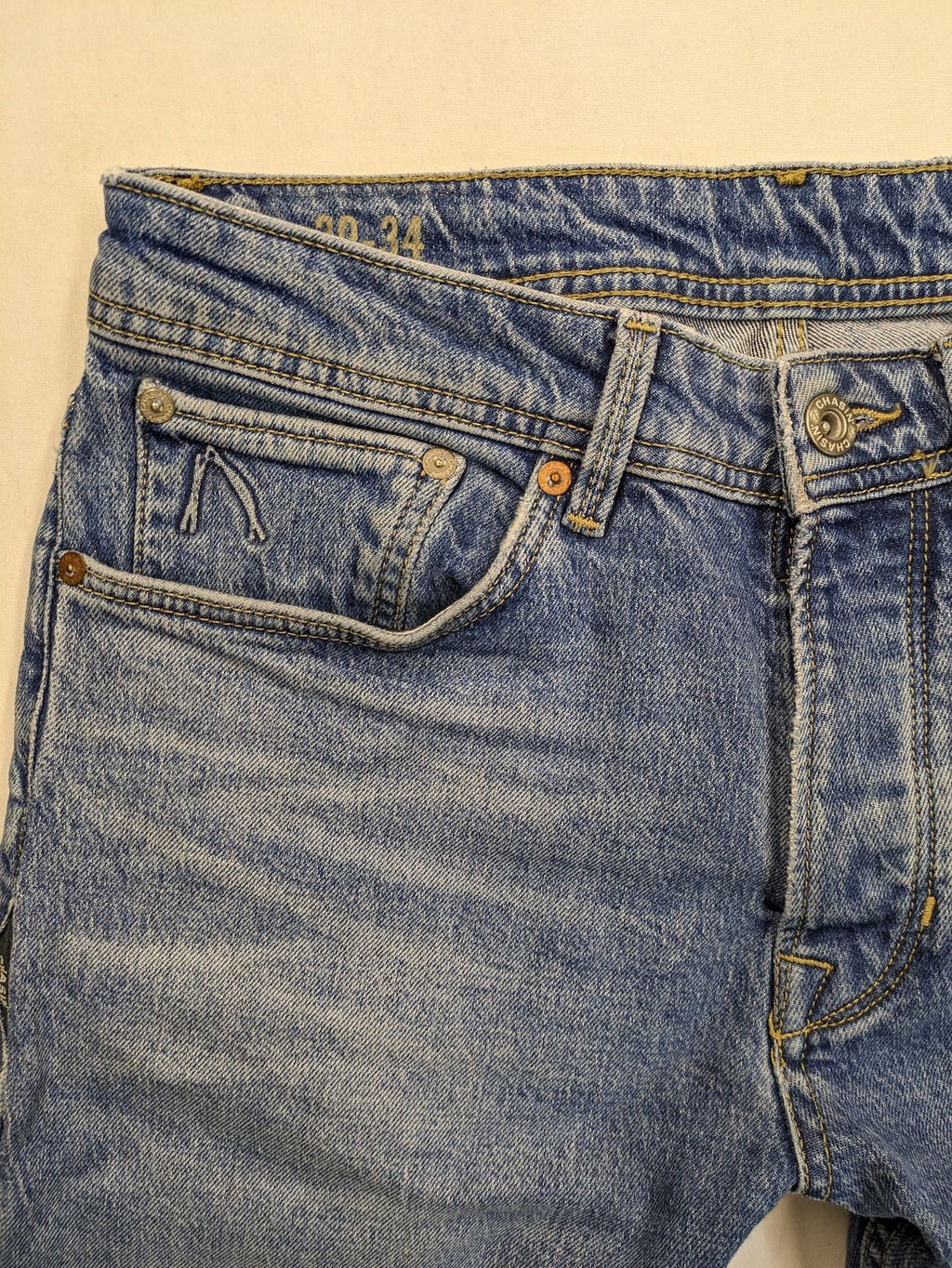 CHASIN' blue slim fit jeans with button fly and classic denim craftsmanship.