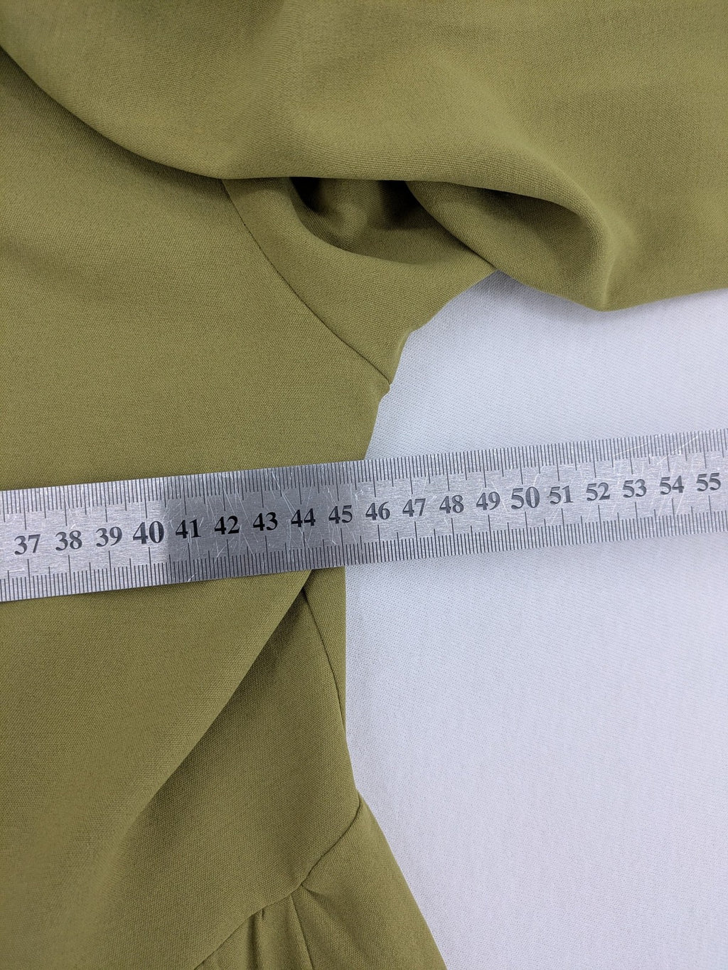 Buqre Store khaki A-line dress with puff sleeves, ruffled cuffs, and button placket.
