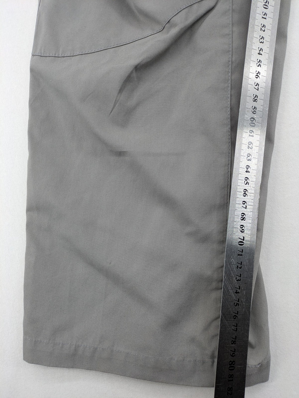 YETI grey cargo pants with multiple zippered pockets and durable material.