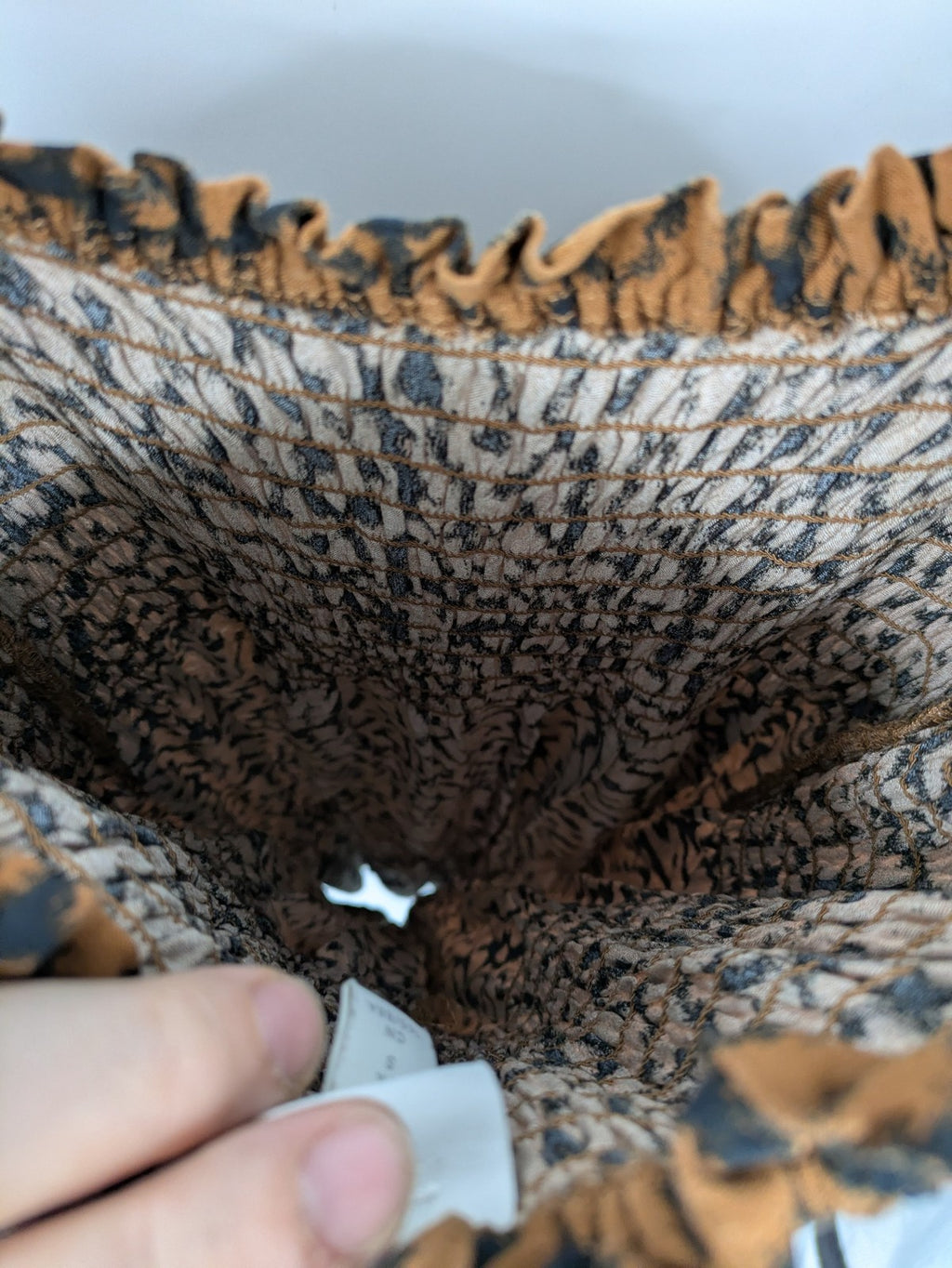 H&M brown and black animal print midi dress with smocked bodice and square neckline.