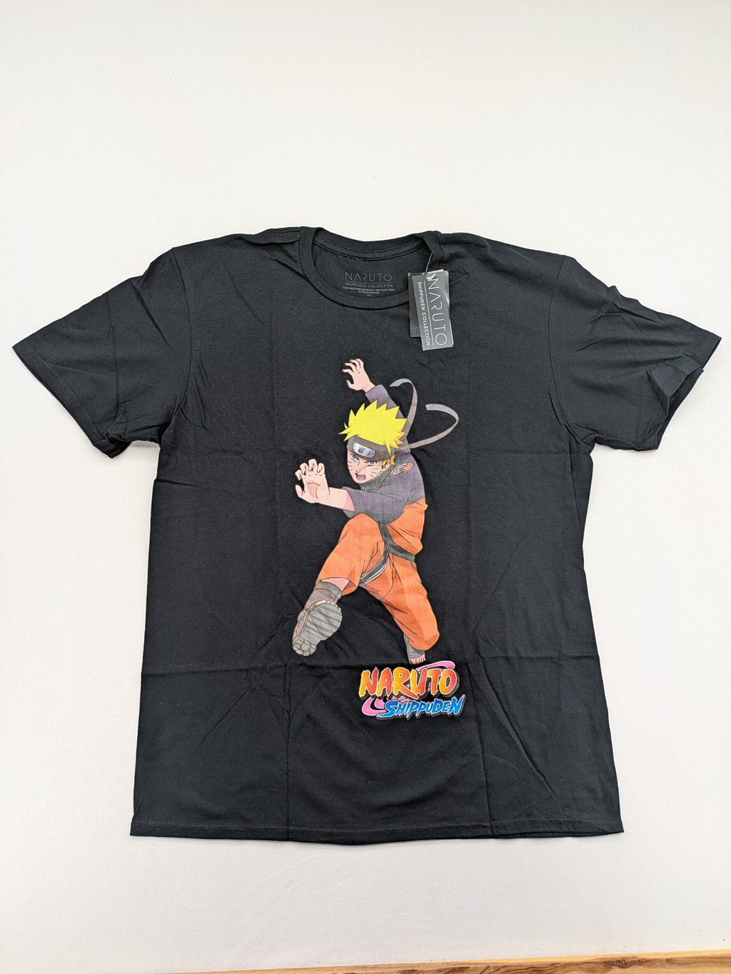 Naruto Shippuden black graphic t-shirt featuring colorful Naruto Uzumaki design, 100% cotton.