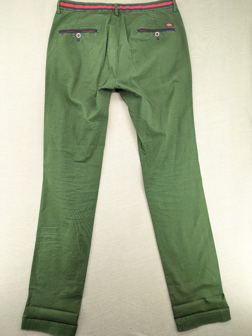 Mason's green chino pants with striped red and blue waistband, cotton stretch material.