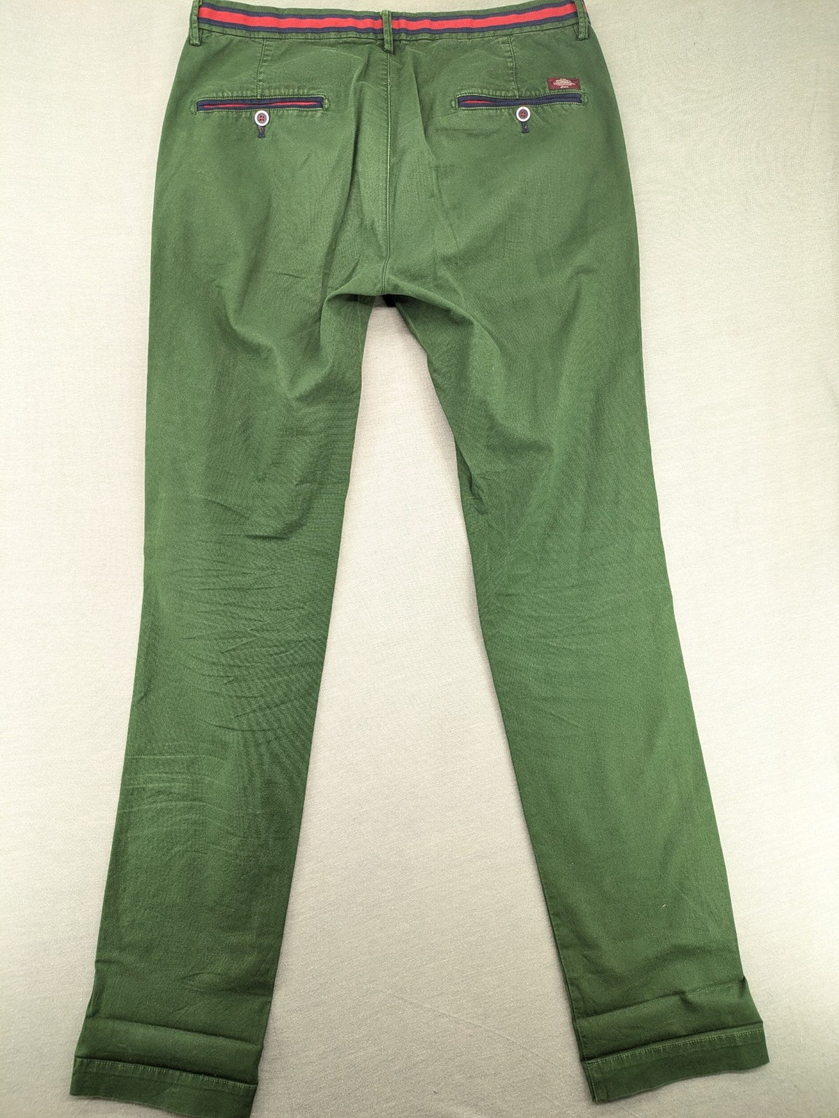 Mason's green chino pants with striped red and blue waistband, cotton stretch material.