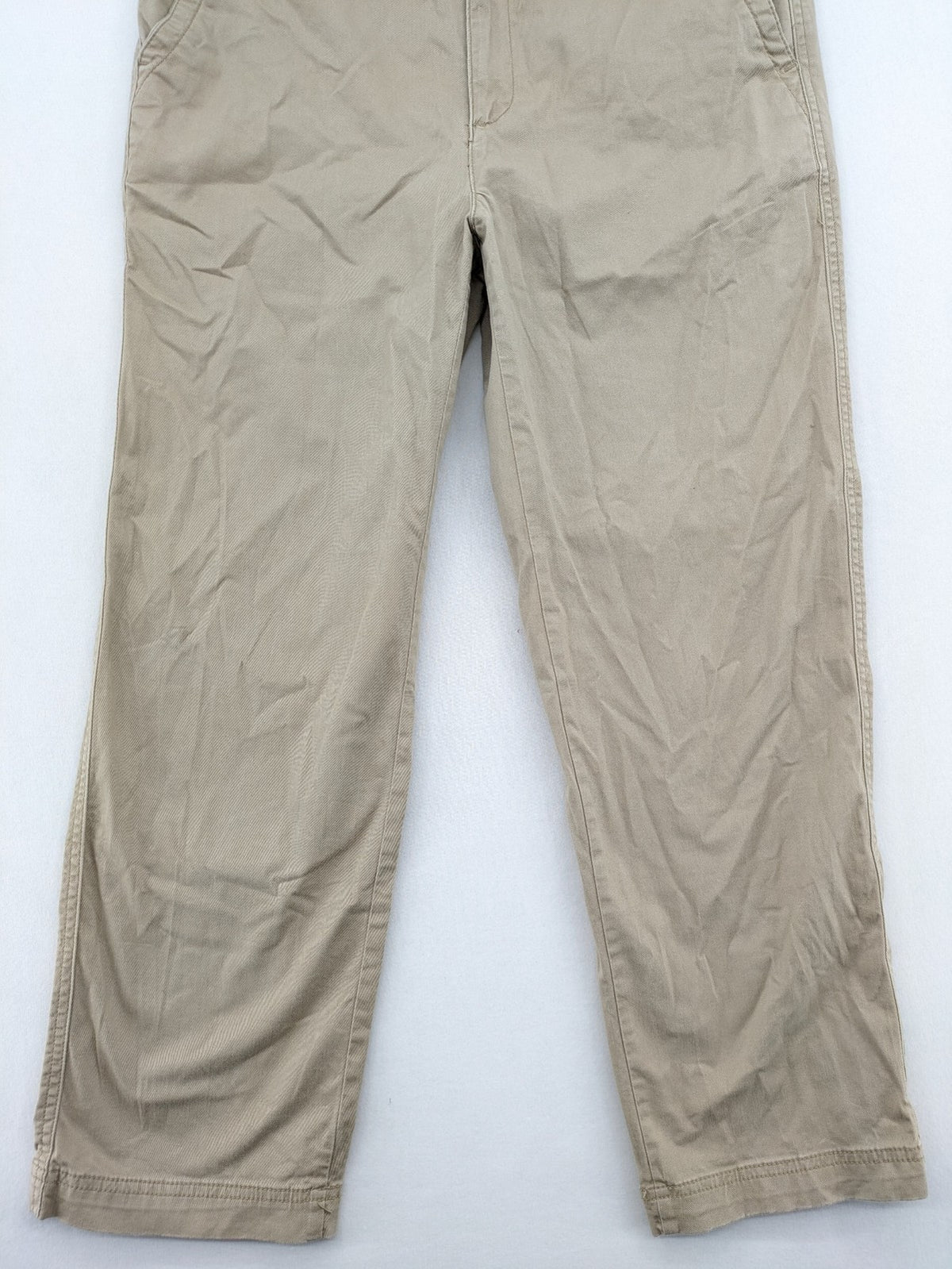 Gap beige girlfriend chino pants with relaxed fit and soft cotton-stretch blend.
