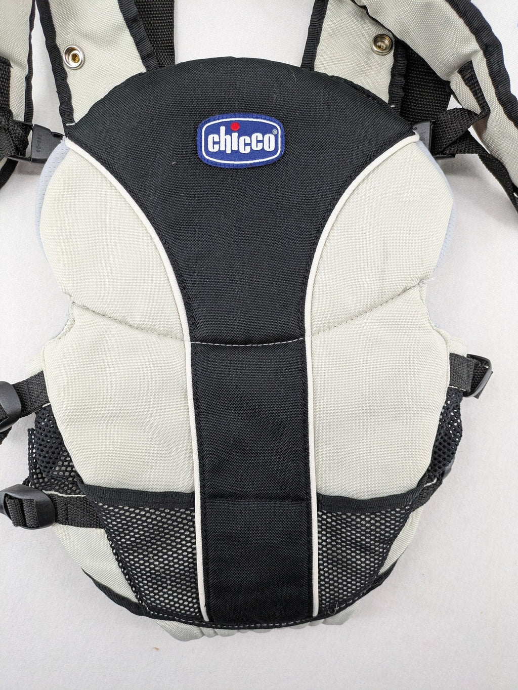 Chicco beige and black baby carrier adjustable straps with padded support for comfort.