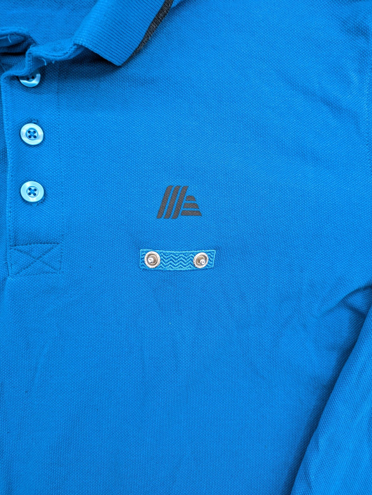 Aldi blue long sleeve polo shirt with embroidered logo and classic collar.